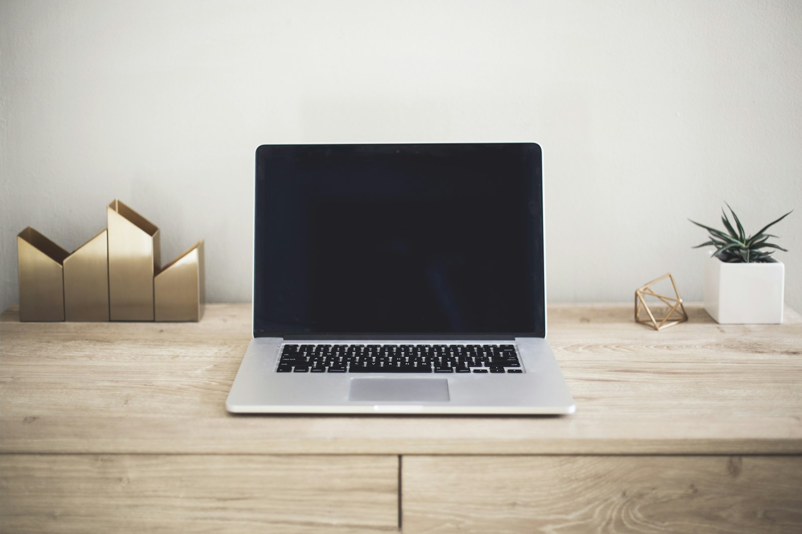 Laptop on a clean desk in a home workspace